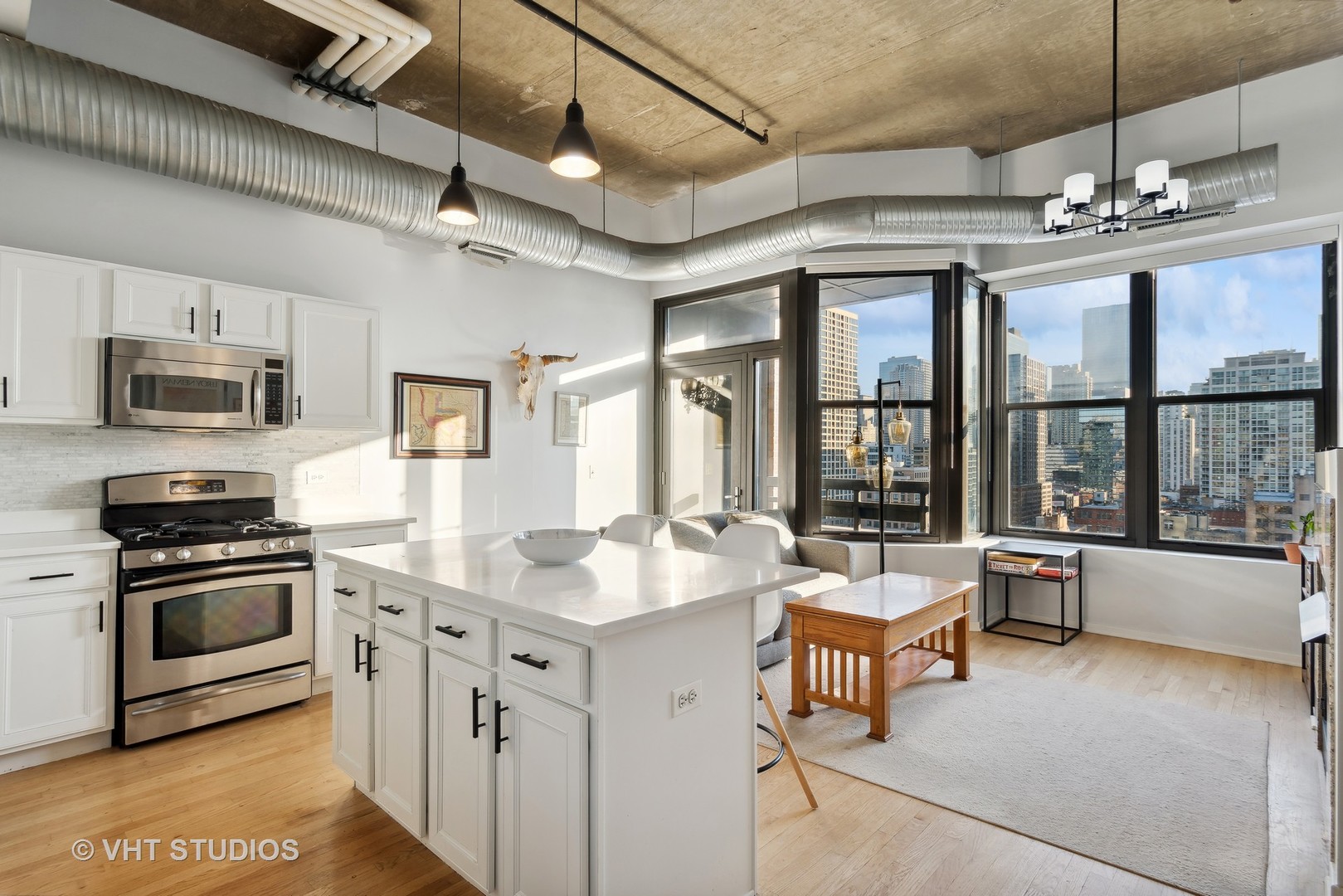 849 North Franklin Street, Unit 1419 Chicago, IL 60610 - Photo 5 of 10 a kitchen with stainless steel appliances granite countertop a sink and stove