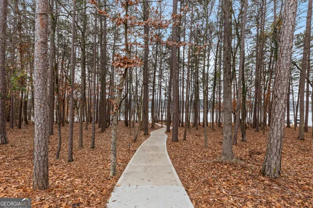 a kitchen with stainless steel appliances kitchen island granite countertop a stove a sink and a refrigerator