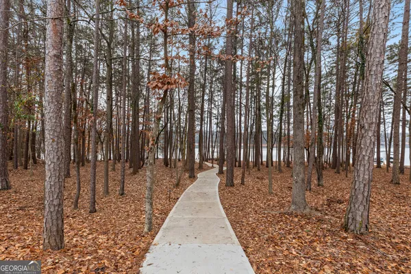 a front view of a house with yard and garage