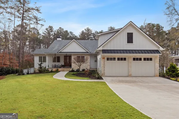 a view of house with yard in front of it