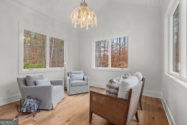 a bathroom with a double vanity sink toilet mirror and bathtub