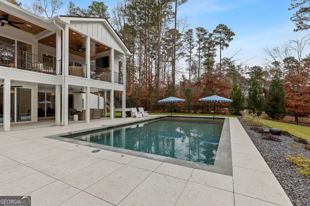 a kitchen with stainless steel appliances kitchen island granite countertop a stove a sink and a refrigerator
