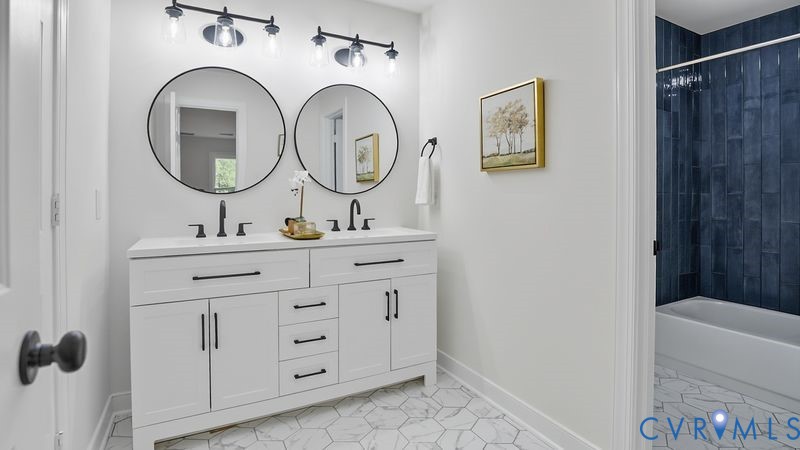 12601 Eagle Ridge Road Henrico, VA 23233 - Photo 26 of 50 Full bath featuring double vanity, light tile patt
