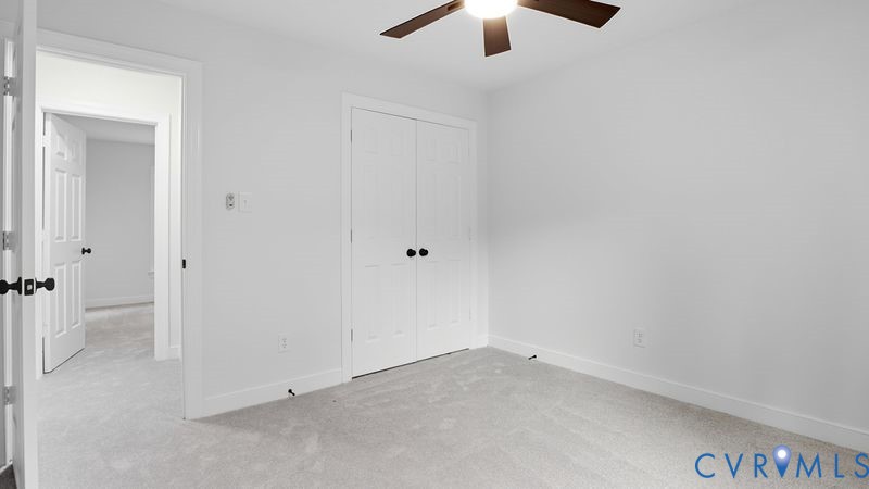 12601 Eagle Ridge Road Henrico, VA 23233 - Photo 31 of 50 Unfurnished bedroom featuring light carpet, a clos