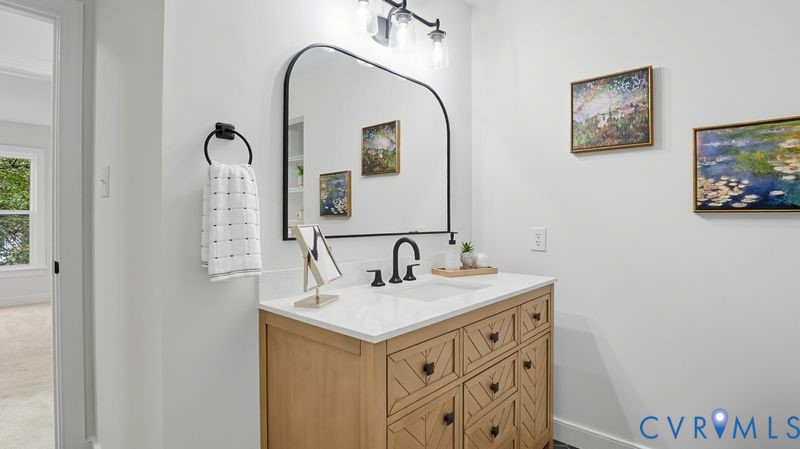12601 Eagle Ridge Road Henrico, VA 23233 - Photo 35 of 50 Half bathroom featuring vanity and baseboards