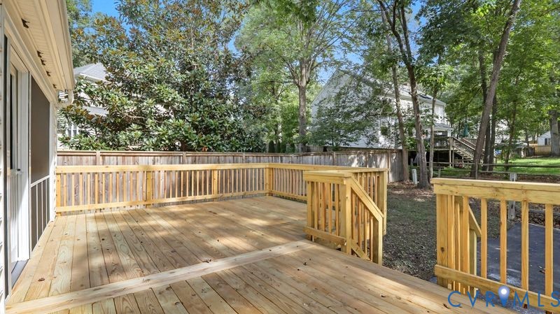 12601 Eagle Ridge Road Henrico, VA 23233 - Photo 42 of 50 Wooden deck with a fenced backyard