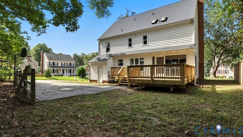 12601 Eagle Ridge Road Henrico, VA 23233 - Photo 46 of 50 Rear view of property featuring a lawn, a deck, an