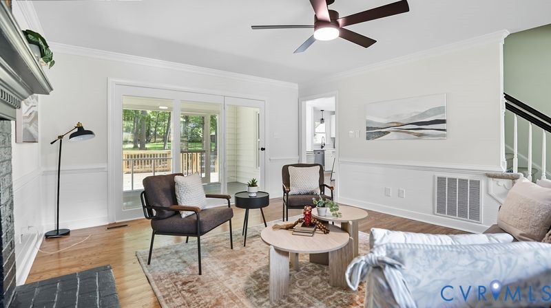 12601 Eagle Ridge Road Henrico, VA 23233 - Photo 5 of 50 Living area with crown molding, wood finished floo