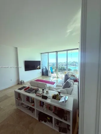 a room with furniture and a flat screen tv