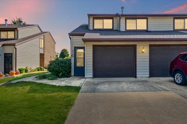 a view of a car parked in front of a house