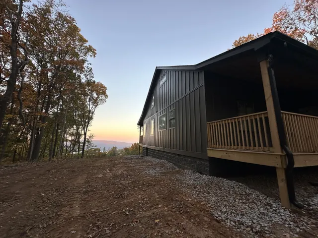 a view of balcony with wooden fence and floor