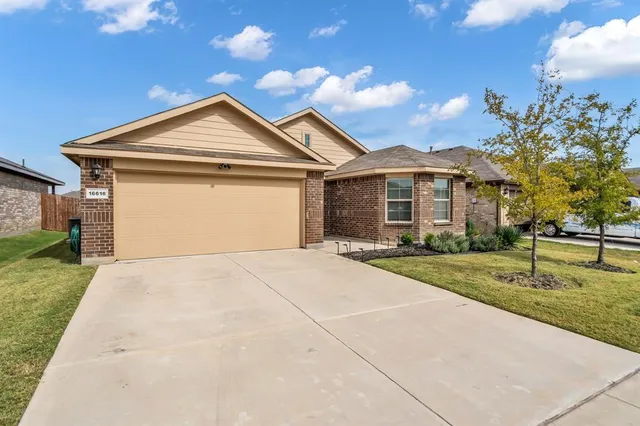 a front view of a house with yard