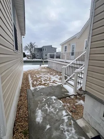 a view of a living room and kitchen