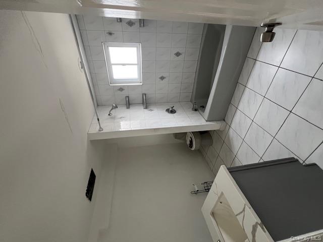 817 Ocean Street Lindenhurst, NY 11757 - Photo 14 of 14 a bathroom with a bathtub and shower
