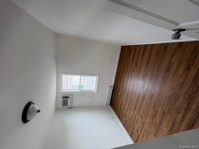 817 Ocean Street Lindenhurst, NY 11757 - Photo 2 of 14 a view of an empty room with wooden floor and a window