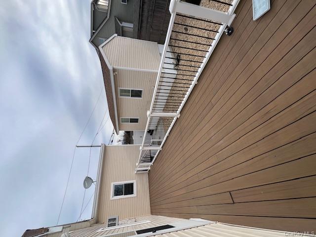 817 Ocean Street Lindenhurst, NY 11757 - Photo 8 of 14 a view of a house with wooden deck