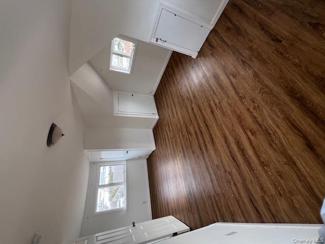 817 Ocean Street Lindenhurst, NY 11757 - Photo 9 of 14 an empty room with wooden floor and windows
