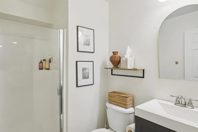 a bedroom with a bed and a couch