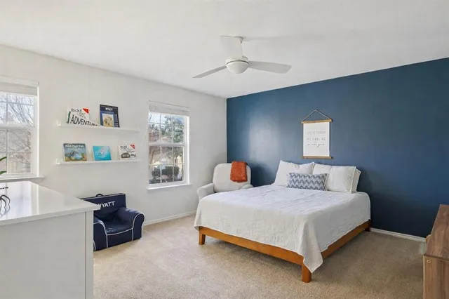 a bedroom with a bed and cabinets