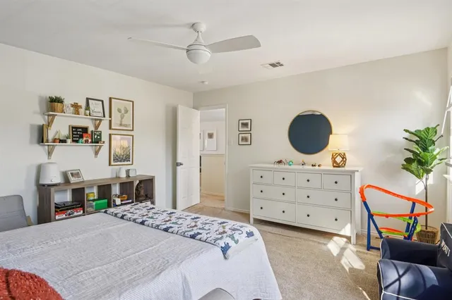 a bathroom with a sink a toilet and shower curtain