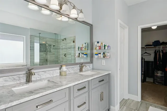 a bathroom with a shower and a sink