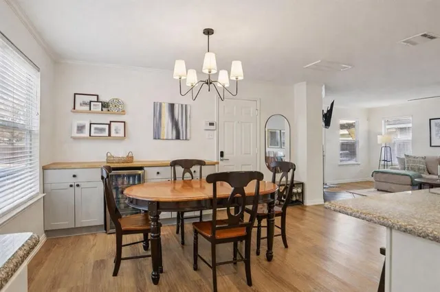 a kitchen with kitchen island granite countertop a sink stove and refrigerator