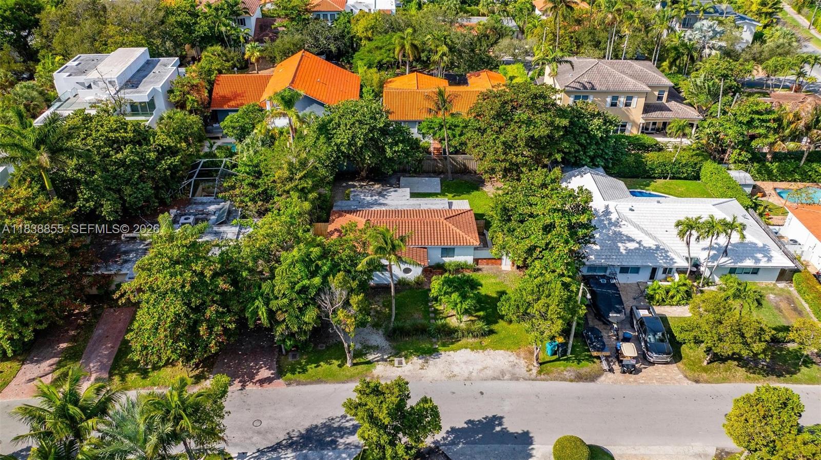 738 Fernwood Road Key Biscayne, FL 33149 - Photo 11 of 39 an aerial view of a house with a yard and garden