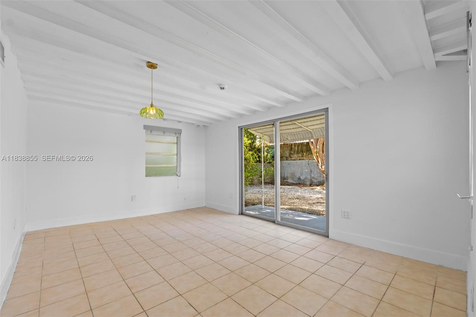 738 Fernwood Road Key Biscayne, FL 33149 - Photo 14 of 39 a view of an empty room and window