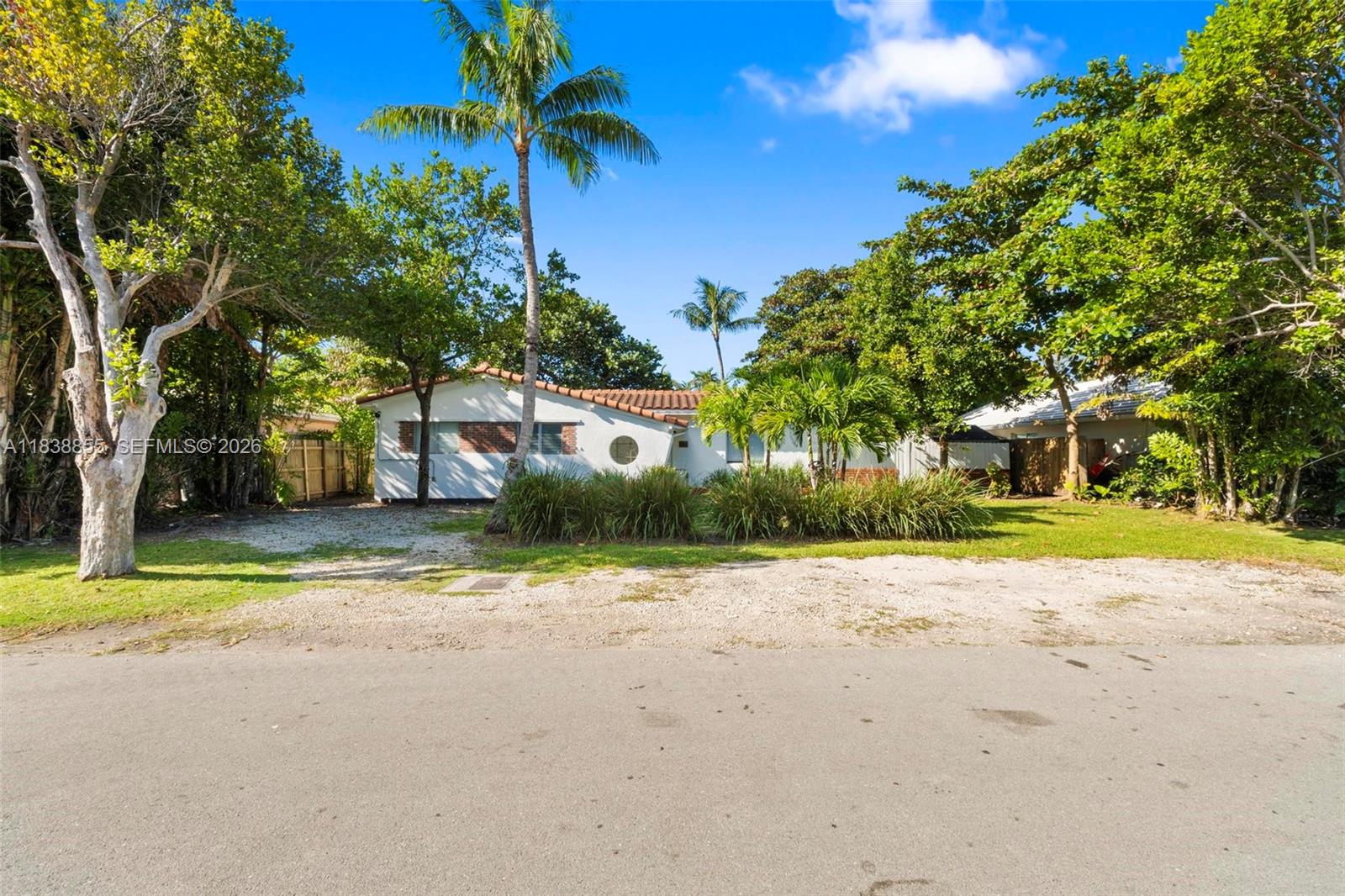 738 Fernwood Road Key Biscayne, FL 33149 - Photo 2 of 39 a view of road and trees