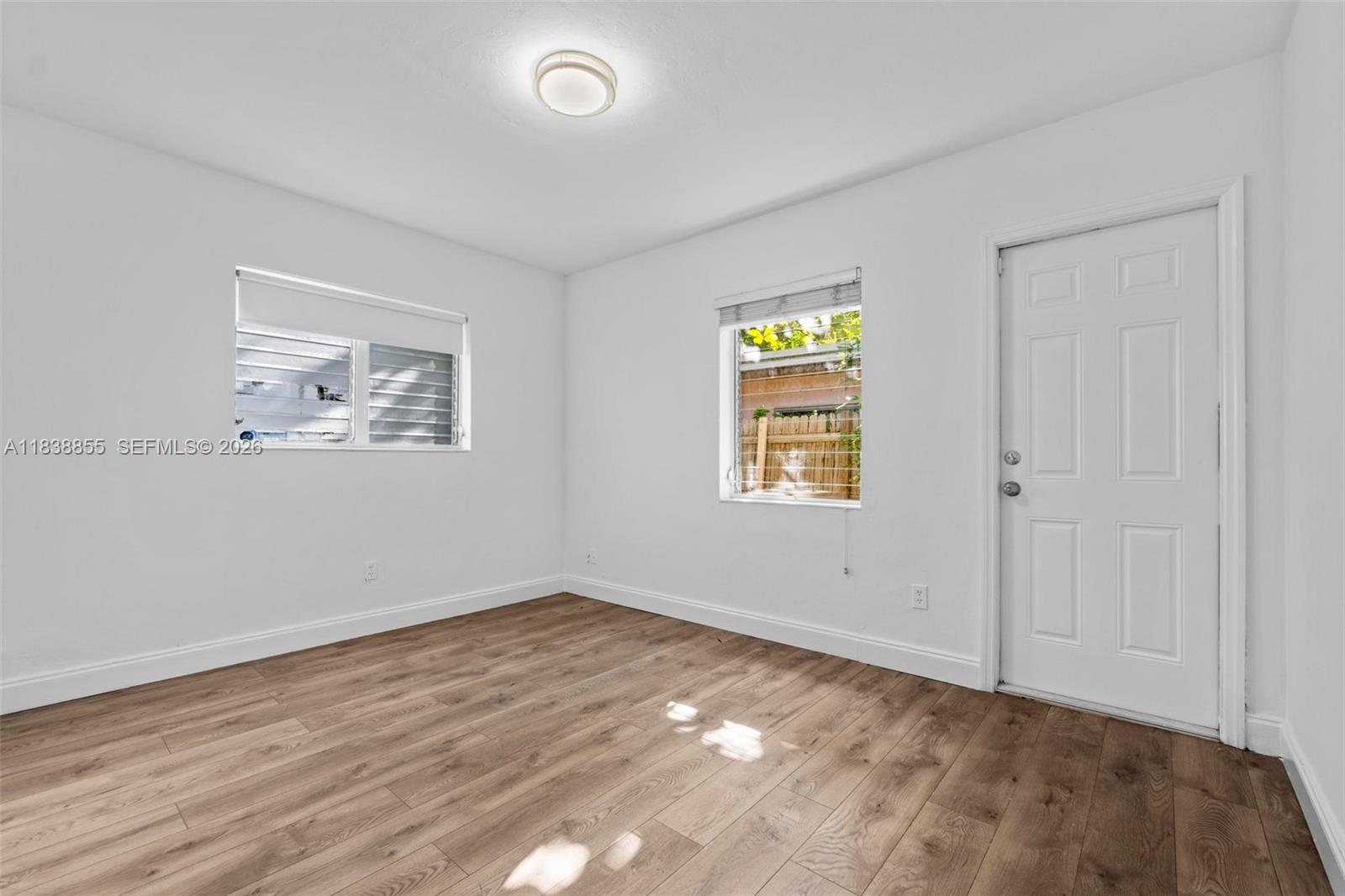 738 Fernwood Road Key Biscayne, FL 33149 - Photo 26 of 39 an empty room with a window