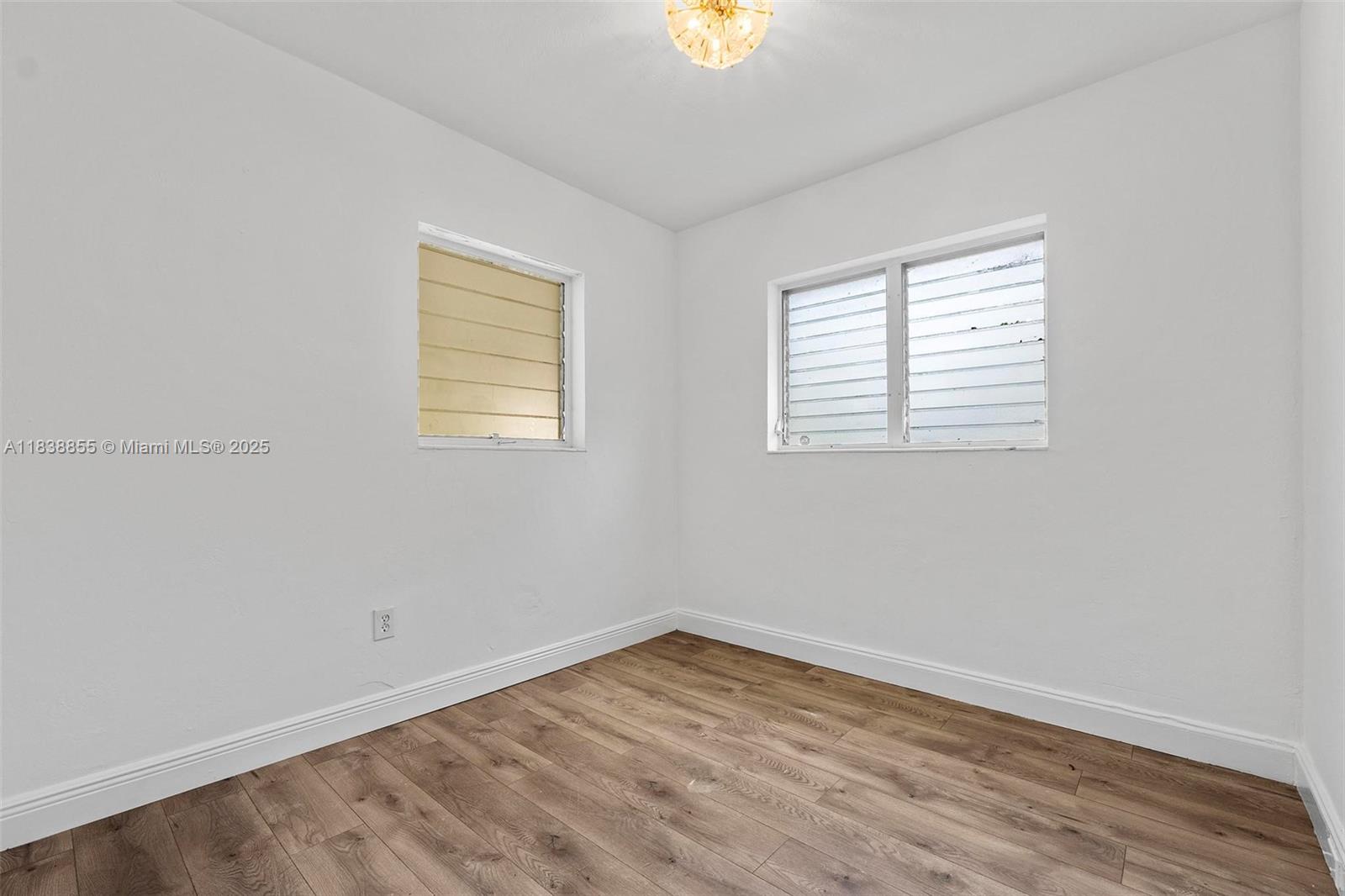 738 Fernwood Road Key Biscayne, FL 33149 - Photo 29 of 43 an empty room with a window