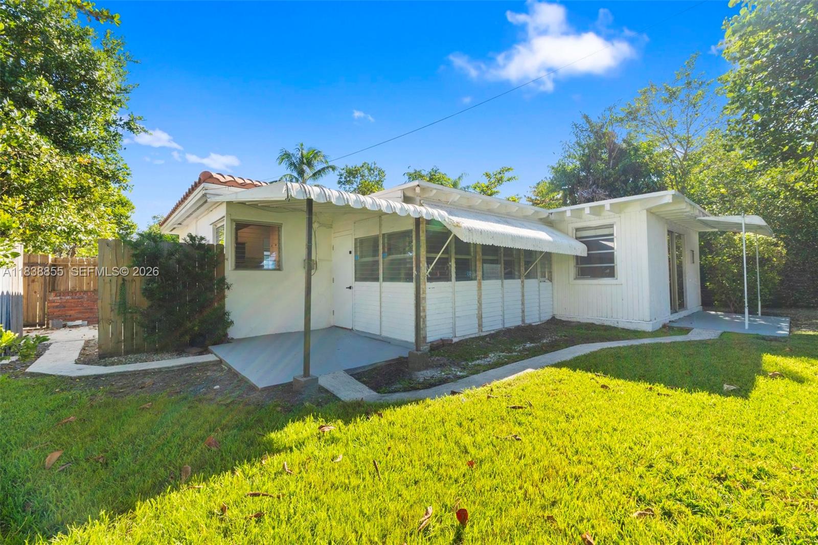 738 Fernwood Road Key Biscayne, FL 33149 - Photo 32 of 39 a view of a house with a swimming pool