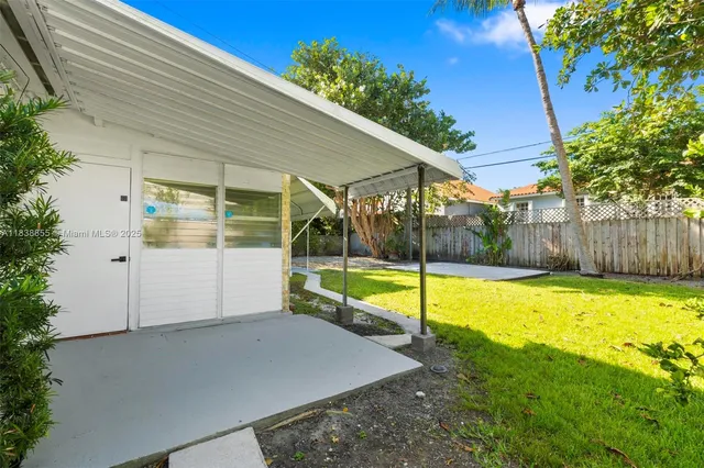 a view of a backyard with swimming pool