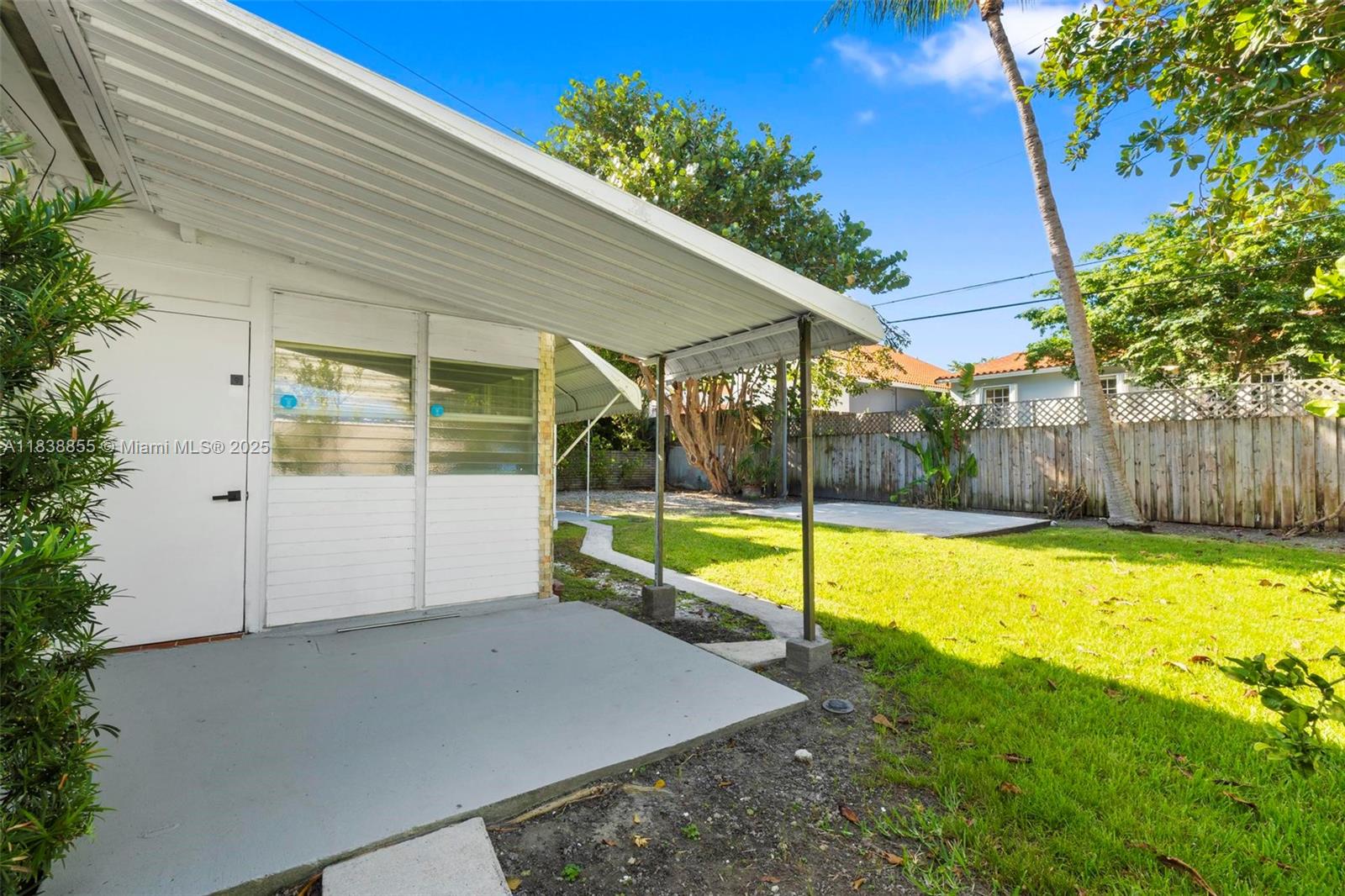 738 Fernwood Road Key Biscayne, FL 33149 - Photo 32 of 43 a view of a backyard with swimming pool
