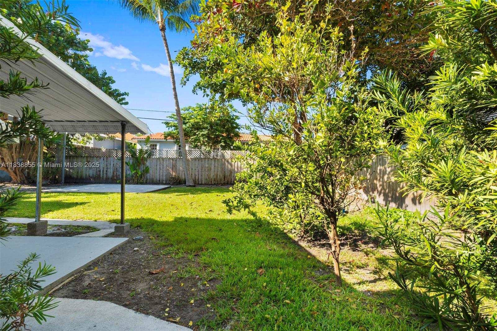 738 Fernwood Road Key Biscayne, FL 33149 - Photo 33 of 43 a view of a backyard with swimming pool