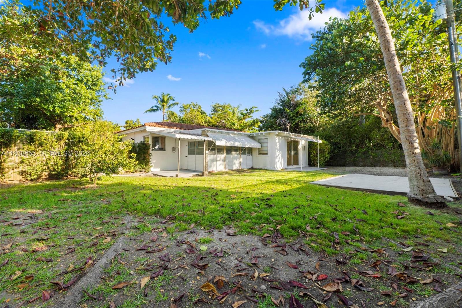 738 Fernwood Road Key Biscayne, FL 33149 - Photo 34 of 39 a front view of a house with garden