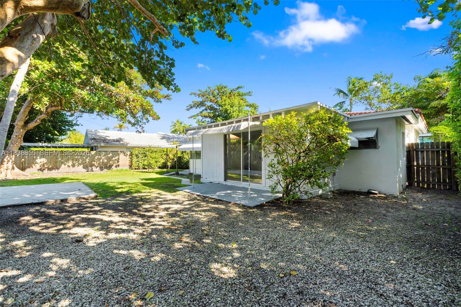 738 Fernwood Road Key Biscayne, FL 33149 - Photo 36 of 39 a view of a house with backyard and garden