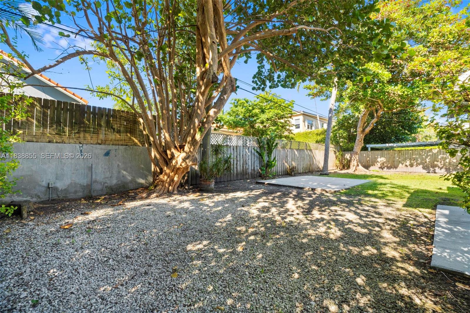 738 Fernwood Road Key Biscayne, FL 33149 - Photo 37 of 39 a view of a yard with a tree