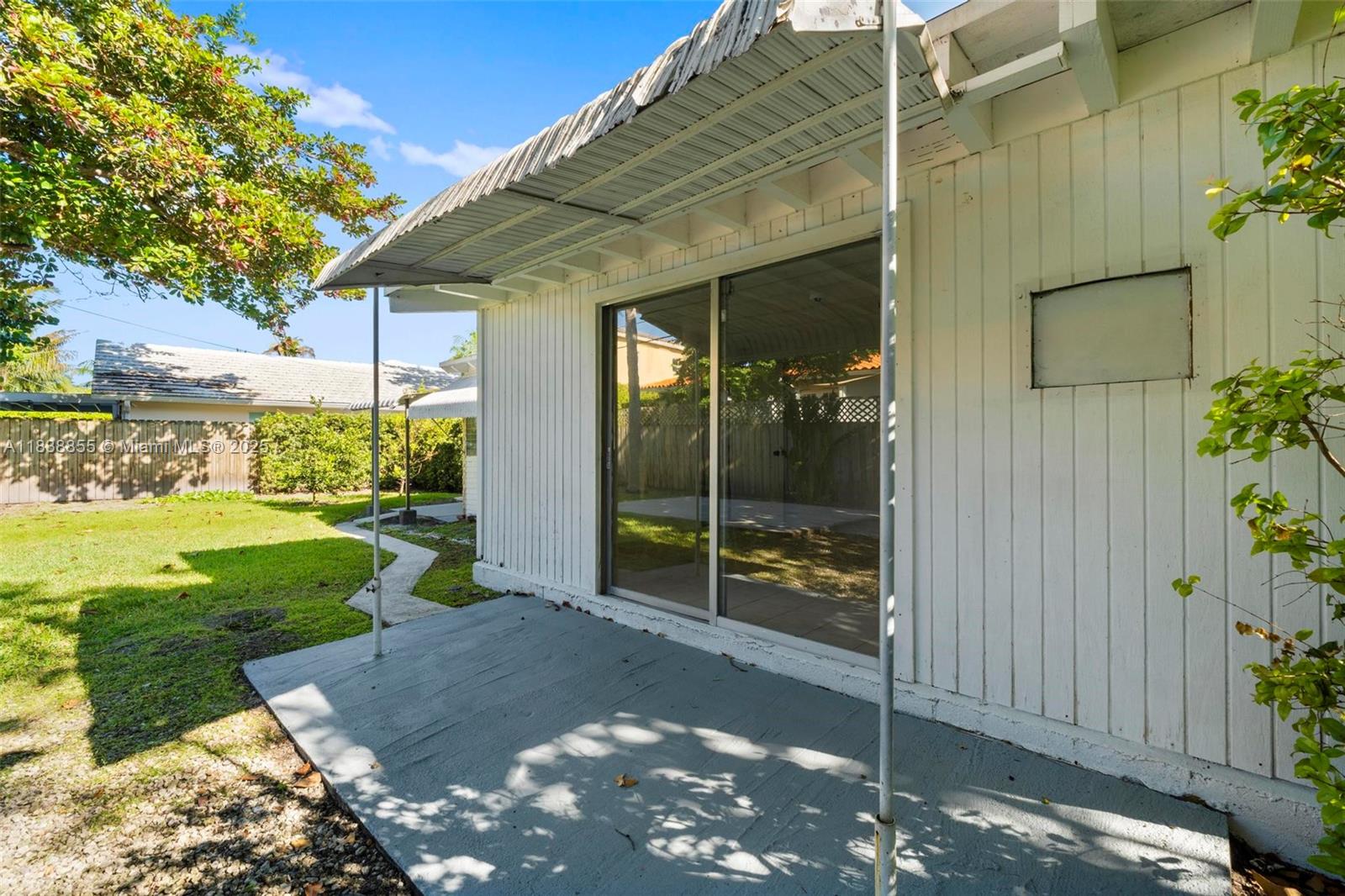 738 Fernwood Road Key Biscayne, FL 33149 - Photo 40 of 43 a view of a porch with a yard