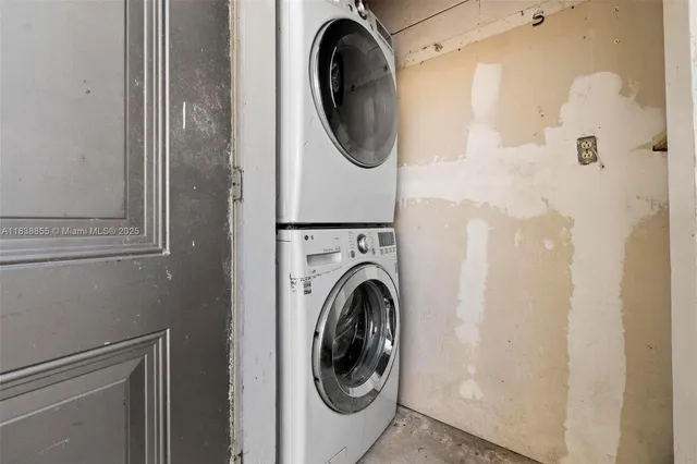 a close view of a utility room with dryer and washer