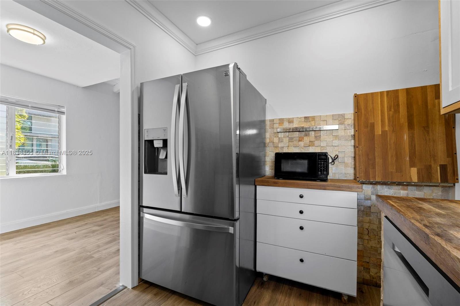 738 Fernwood Road Key Biscayne, FL 33149 - Photo 7 of 43 a kitchen with stainless steel appliances a refrigerator sink and microwave