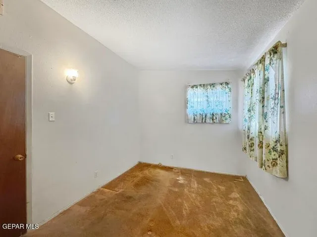 a view of a room with a large window