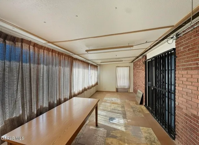 a view of a back yard from a balcony