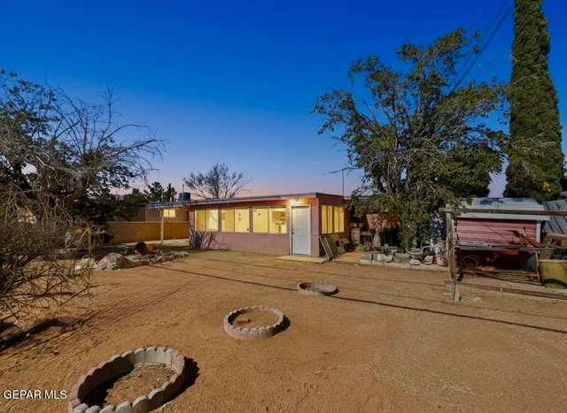 a view of a backyard of the house
