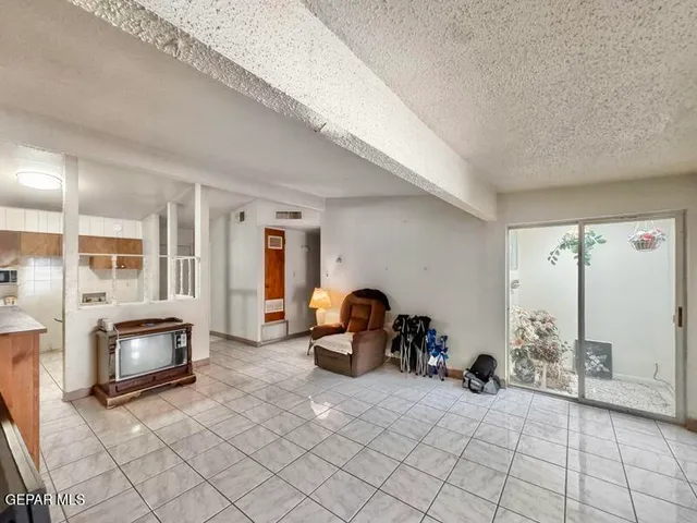a view of a livingroom with furniture and toys
