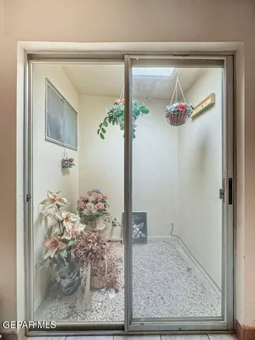 a view of a workspace with furniture