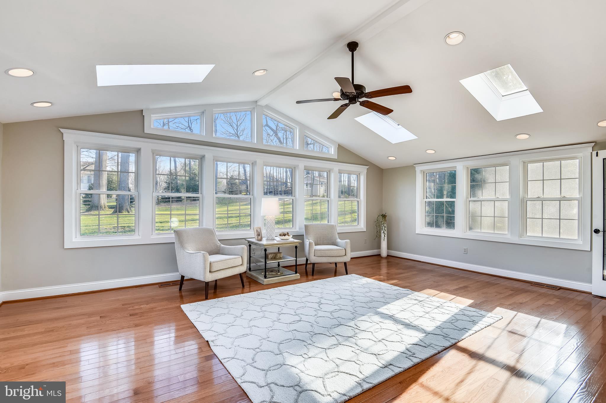 3221 Miller Heights Road Oakton, VA 22124 - Photo 12 of 60 Walls Of Windows & Hardwood Flooring in Sunroom.