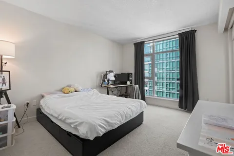 a view of an empty room and a window