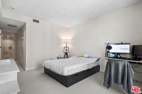 a bathroom with a double vanity sink toilet and shower