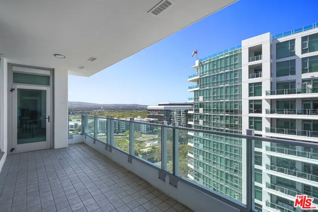 a view of a balcony with chairs